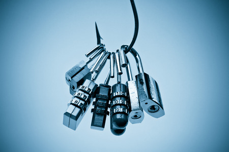 A big fish hook with security locks - Computer data theft concept / phishingの写真素材