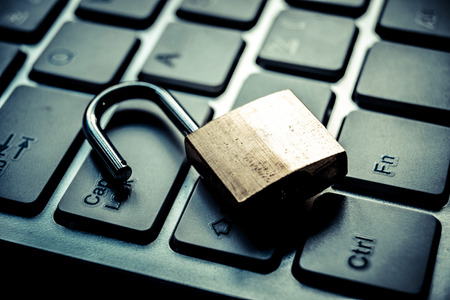 open security lock on computer keyboard - computer security breach concept