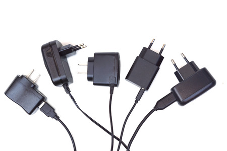 Different types of adapter charger on isolated backgroundの写真素材