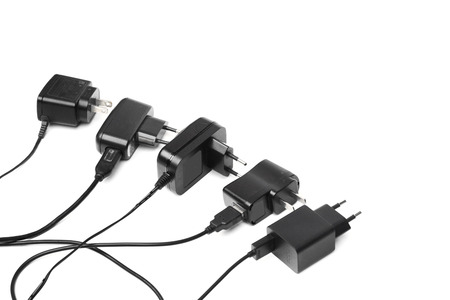 Different types of adapter charger on isolated backgroundの写真素材