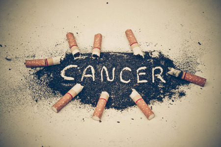 cigarette ash with text cancerの写真素材