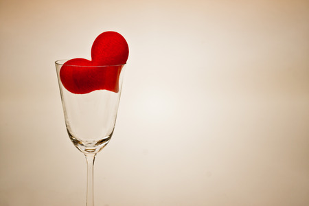 a red heart in a wine glassの写真素材