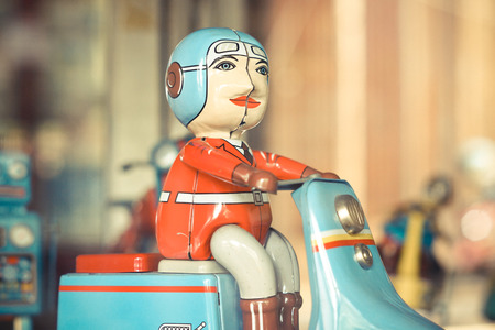 old classic motorcycle toy with riderの写真素材