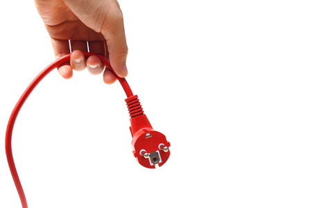 hand unplug a red plug / Save energy conceptの写真素材