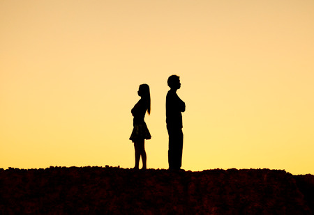 Silhouette of a angry woman and man on each other  Relationship difficulties  Couple break upの写真素材