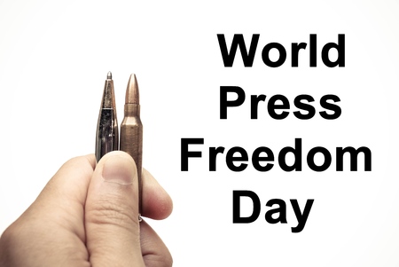 Pen vs. Bullet / Freedom of the press is at risk concept / World press freedom day conceptの写真素材