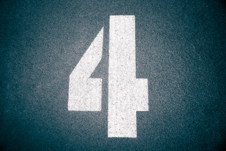 Number four on running race lane in blue toneの写真素材