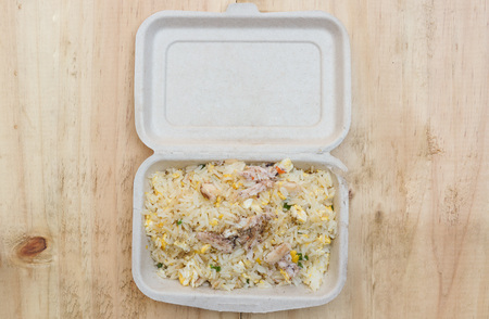 take away food in a paper box on wooden tableの写真素材