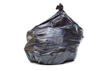 Black plastic garbage bag isolatedの写真素材