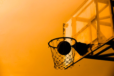 Basketball in a netの写真素材