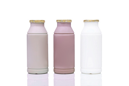 Plastic bottle milk in three different flavors - coffee, chocolate and fresh milkの写真素材