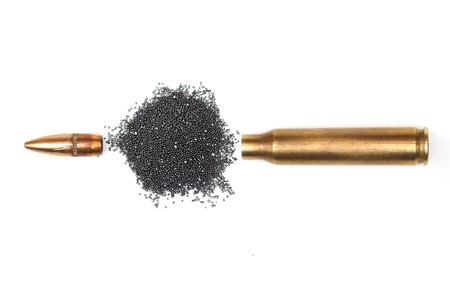 A rifle bullet with gun powder isolatedの写真素材