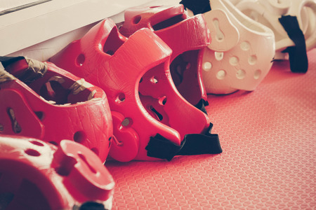 Taekwondo head guard on a training mat in old vintage toneの写真素材