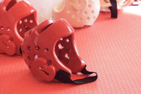 Taekwondo head guard on a training mat in old vintage toneの写真素材