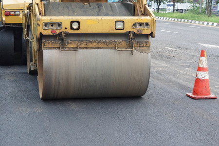 Road paving / Road roller compacting asphalt