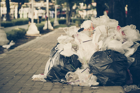A pile of garbage in old sad tone / Waste and garbage mismanagement conceptの写真素材