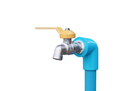 A faucet with blue PVC pipe isolated