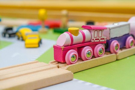 Wooden toy on the rail / Wooden toy for kidsの写真素材