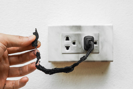 Electricity short circuit / Electrical failure resulting in electricity wire burntの写真素材