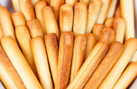 Baked bread stick in a white bowlの写真素材