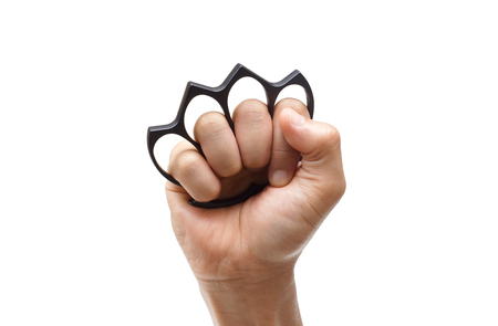 Male hand wearing a black knuckle isolatedの写真素材