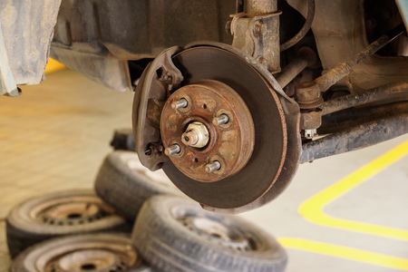 Car in garage replacing tiresの写真素材