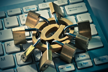 Email sign with many padlocks on computer keyboard / Email encryption security and countermeasure conceptの写真素材