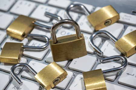 Security lock on computer keyboard - Computer security with data encryption concept