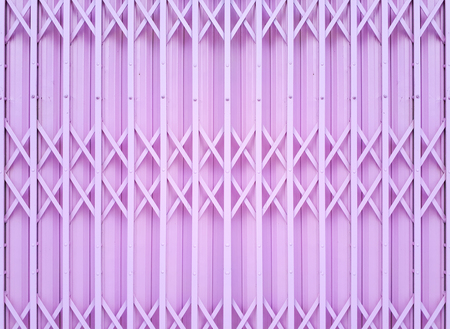 Steel foldable door background in pink colorの写真素材