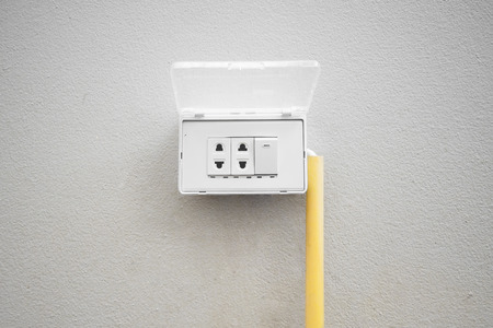 Electricity socket with plastic cover to prevent water getting inside and electricity short circuit