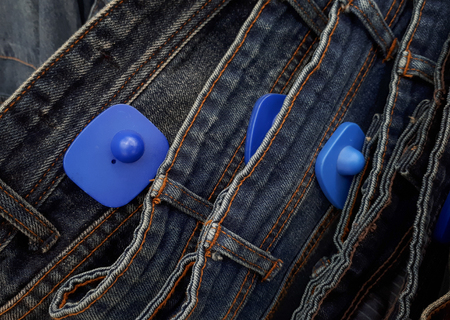 RFID hard tag for clothing - Shoplifting and anti-theft system - Electronic Article Surveillance system used with high-value goodsの写真素材