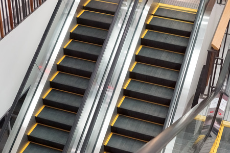 Two escalators going up and down