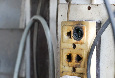 Electrical outlet damaged / Electricity safety in houseの写真素材