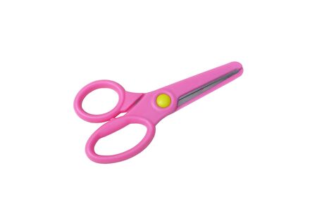 Pink plastic scissors for kid isolated on white backgroundの写真素材