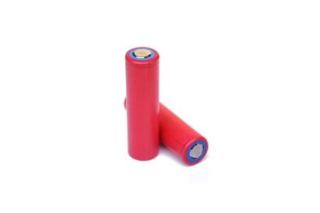 Lithium rechargeable battery in red color isolated on white backgroundの写真素材