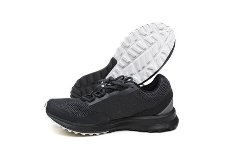 A pair of trail running shoes isolated on white backgroundの写真素材