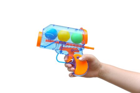 Kid's hand holding a ball gun isolated on white background