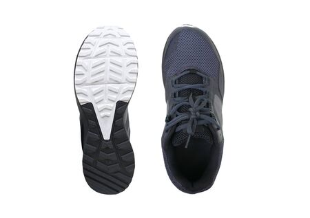 A pair of trail running shoes isolated on white backgroundの写真素材