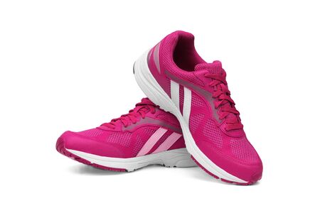 Running shoes in pink color isolated on whiteの写真素材