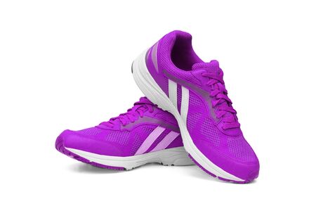 Running shoes in purple color isolated on whiteの写真素材