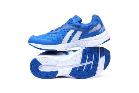Running shoes in blue color isolated on whiteの写真素材