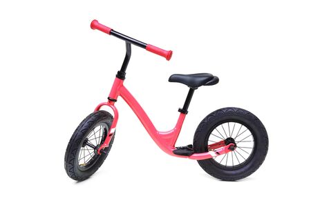 A red balance bike isolated on white backgroundの写真素材