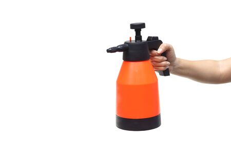Hand holding an air pressure spray bottle for gardening isolated on white backgroundの写真素材