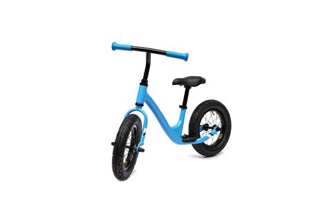 A pink balance bike isolated on white backgroundの写真素材