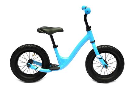 A blue balance bike isolated on white backgroundの写真素材