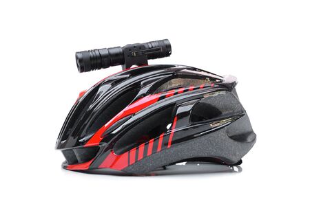 A mountain bike helmet with LED torch for night riding installed on the top isolatedの写真素材