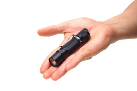 Hand holding a small LED torch isolated / Flashlight for everyday use                             の写真素材