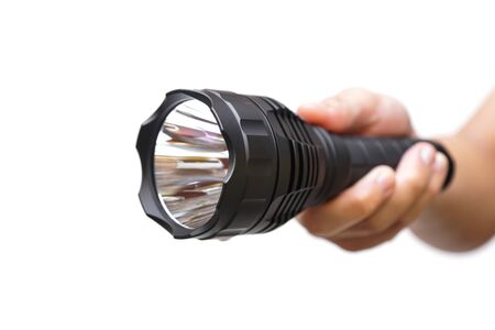 Hand holding a big LED torch isolated / Flashlight for campingの写真素材