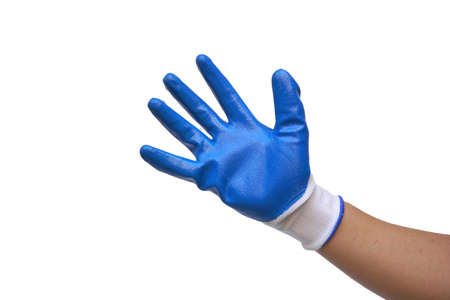 A hand wearing a PVC coated cotton gloves isolated on white backgroundの写真素材