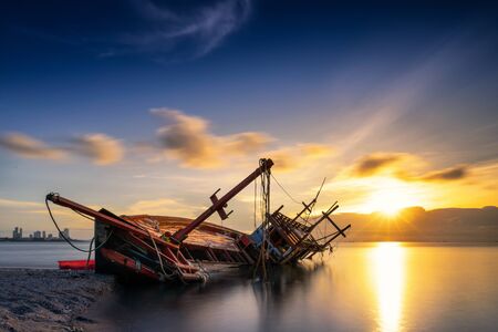 Wooden boat on waterの写真素材